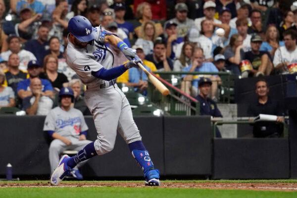 Los Angeles Dodgers' Chris Taylor hits a solo home run during the seventh inning of the team's baseball game against the Milwaukee Brewers in Milwaukee, on Aug. 16, 2022. (Aaron Gash/AP Photo)