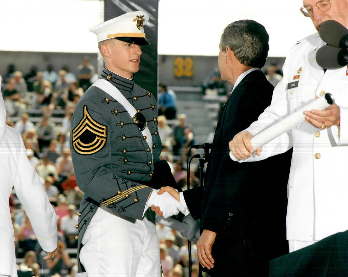 Erik Aadland (L) shakes hands with President George W. Bush (C) at his 2002 graduation from the U.S. Military Academy at West Point, N.Y. (Courtesy of Erik Aadland for Congress)