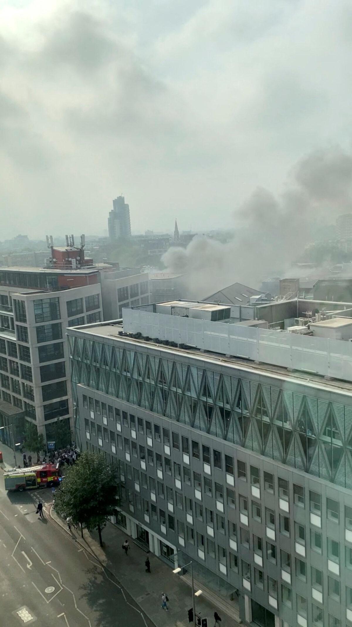 Smoke rises over the Union street after a fire broke out near the London Bridge in London on Aug. 17, 2022. (Twitter/@VV2473/via Reuters)