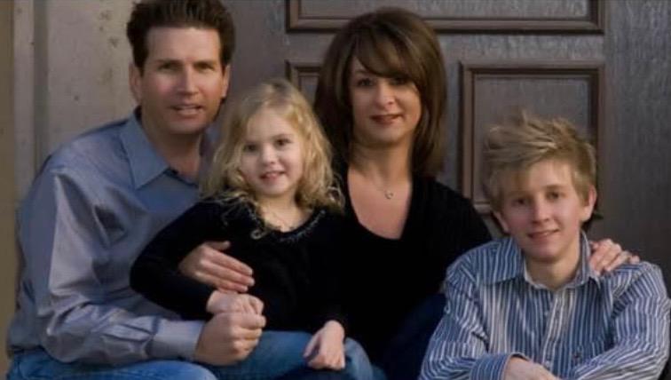 Charlene Carter, a Southwest Airlines flight attendant who sued to get her job back, with her family—husband, Jhara; daughter, Hannah; and son, Christopher Kee—in a portrait from around 2006. (Courtesy of Charlene Carter)
