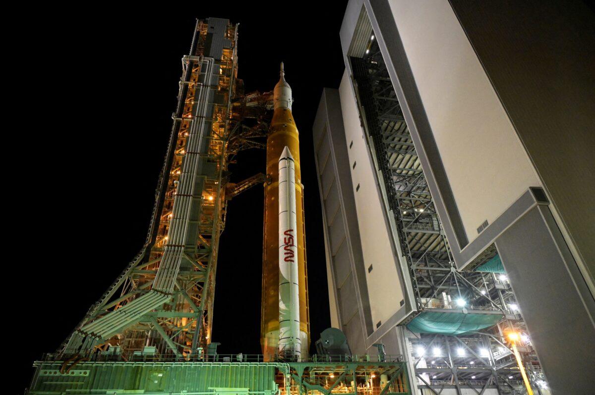 NASA’s next-generation moon rocket, the Space Launch System (SLS) rocket with its Orion crew capsule perched on top, leaves the Vehicle Assembly Building (VAB) on a slow-motion journey to its launch pad at Cape Canaveral, Fla., on Aug. 16, 2022. (Steve Nesius/Reuters)