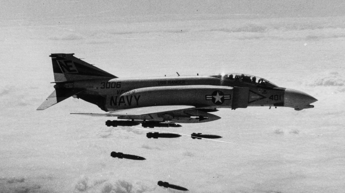An F-4 Phantom releases a load of Mark 82 bombs over South Vietnam. (Courtesy of the US Navy)