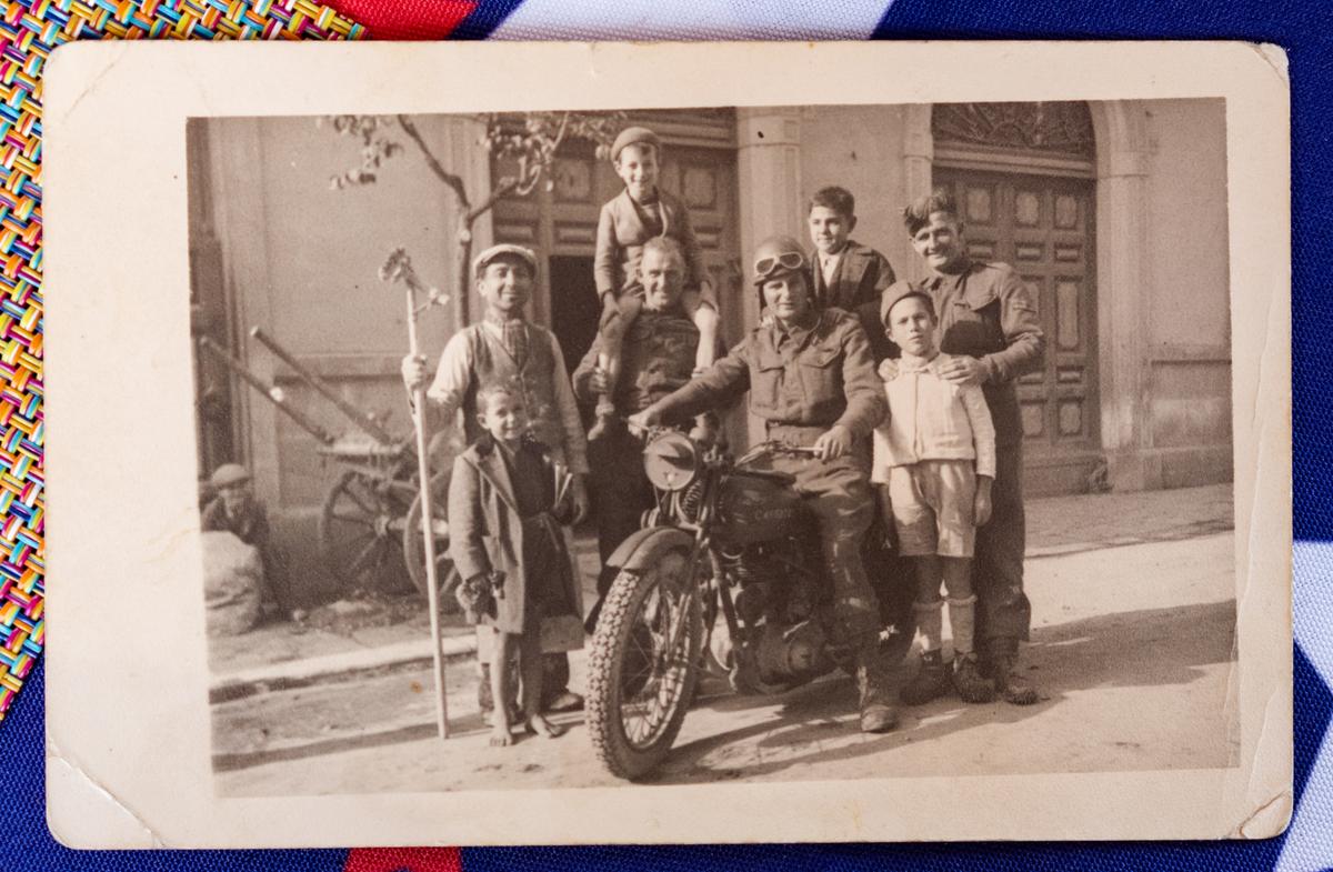 Joe Moraglia, 13, standing behind the soldier on the motorcycle. (Courtesy of the Moraglias)