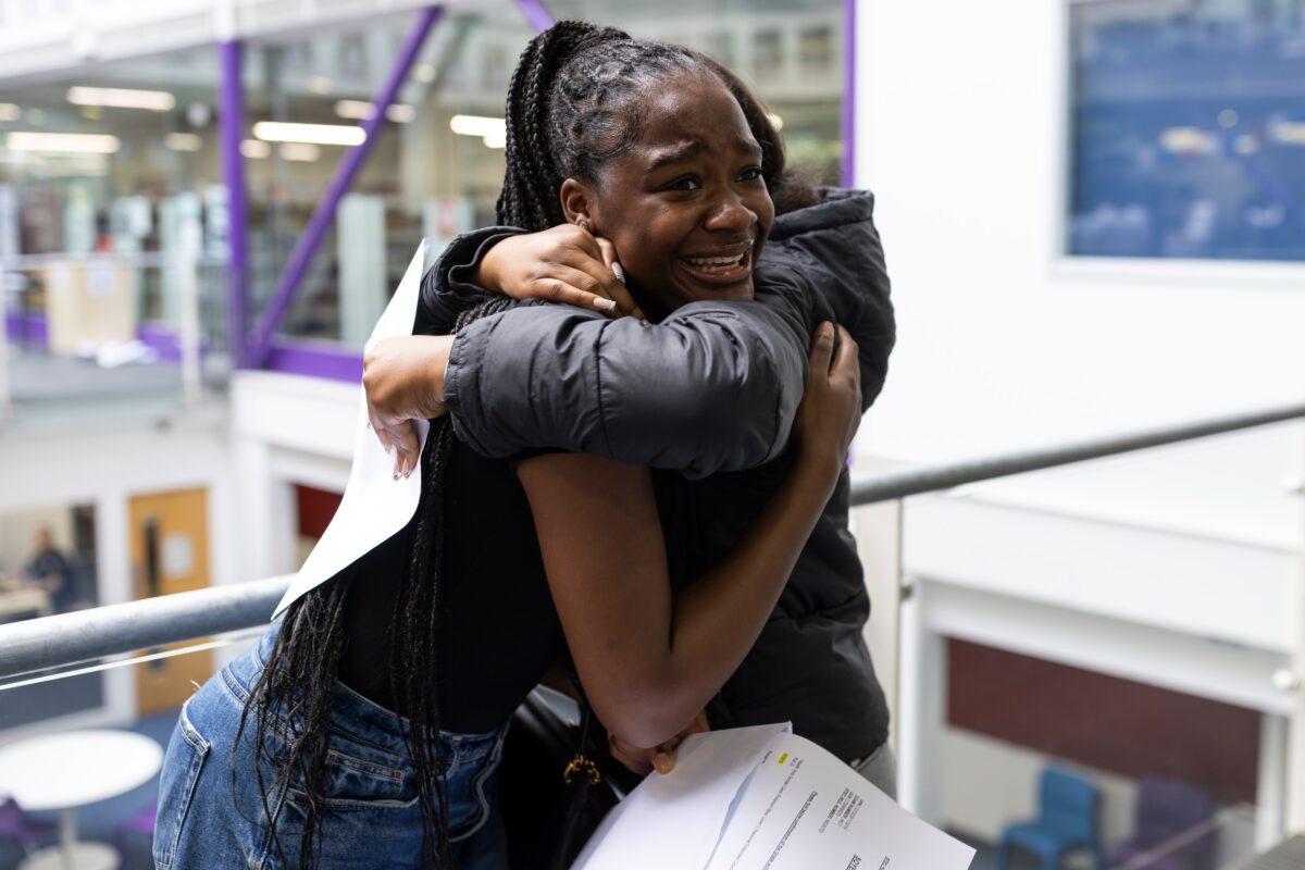 Student Faith Soyer of The City of London Academy in Southwark reacts as she receives her A-Level results in London on Aug. 18, 2022. (Dan Kitwood/Getty Images)