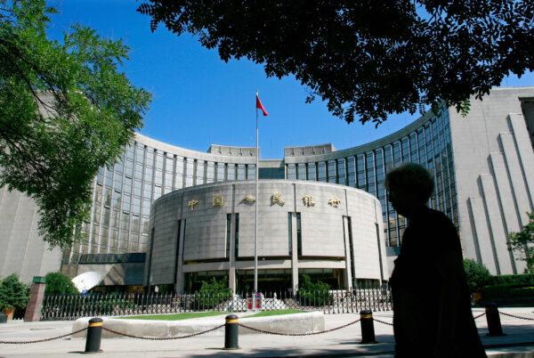 A pedestrian walks past the People's Bank of China, also known as China's Central Bank, in central Beijing, on Aug. 9, 2007. (Teh Eng Koon/AFP via Getty Images)