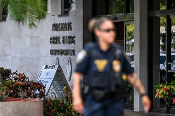 Security officers guard the entrance to the Paul G. Rogers Federal Building & Courthouse as the court holds a hearing to determine if the affidavit used by the FBI as justification for the search of former President Donald Trump's Mar-a-Lago estate should be unsealed, at the U.S. District Courthouse for the Southern District of Florida in West Palm Beach, Fla., on Aug. 18, 2022. (Chandan Khanna/AFP via Getty Images)