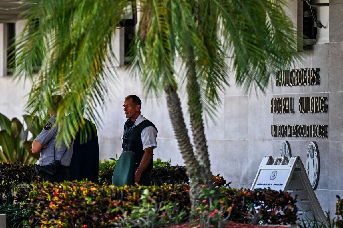 Security officers guard the entrance to the Paul G. Rogers Federal Building & Courthouse as the court holds a hearing to determine if the affidavit used by the FBI as justification for last week's search of Trump's Mar-a-Lago estate should be unsealed, at the U.S. District Courthouse for the Southern District of Florida in West Palm Beach, Fla., on Aug. 18, 2022. (Chandan Khanna/AFP via Getty Images)