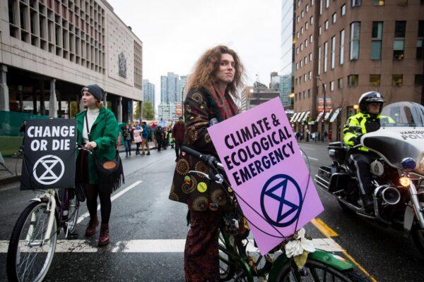 Activists with the group Extinction Rebellion block traffic during a climate change protest in downtown Vancouver on Oct. 18, 2019. (The Canadian Press/Darryl Dyck)