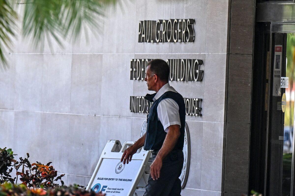 Security officers guard the entrance to the Paul G. Rogers Federal Building and Courthouse as the court holds a hearing to determine if the affidavit used by the FBI as justification for the search of Trump's Mar-a-Lago estate should be unsealed, in West Palm Beach, Fla., on Aug. 18, 2022. (Chandan Khanna/AFP via Getty Images)