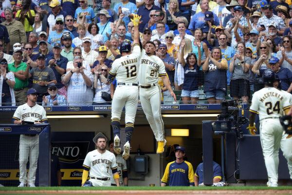 Hunter Renfroe #12 of the Milwaukee Brewers is congratulated by Willy Adames #27 following a two run home run against the Los Angeles Dodgers during the fifth inning at American Family Field in Milwaukee, August 18, 2022. (Stacy Revere/Getty Images)