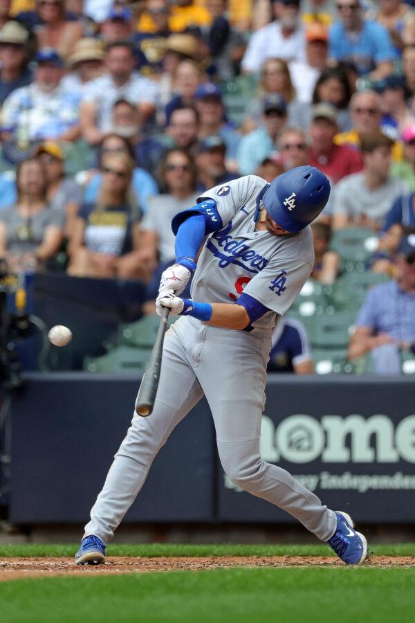 Gavin Lux #9 of the Los Angeles Dodgers hits a two RBI triple against the Milwaukee Brewers during the sixth inning at American Family Field in Milwaukee, August 18, 2022. (Stacy Revere/Getty Images)