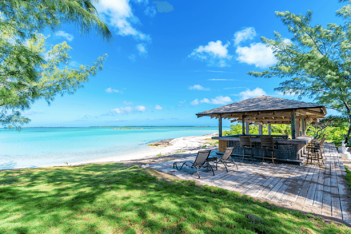 The private beach on the north end features a beach club for family fun or entertaining large groups. (Courtesy of Damianos Sotheby’s International Realty)