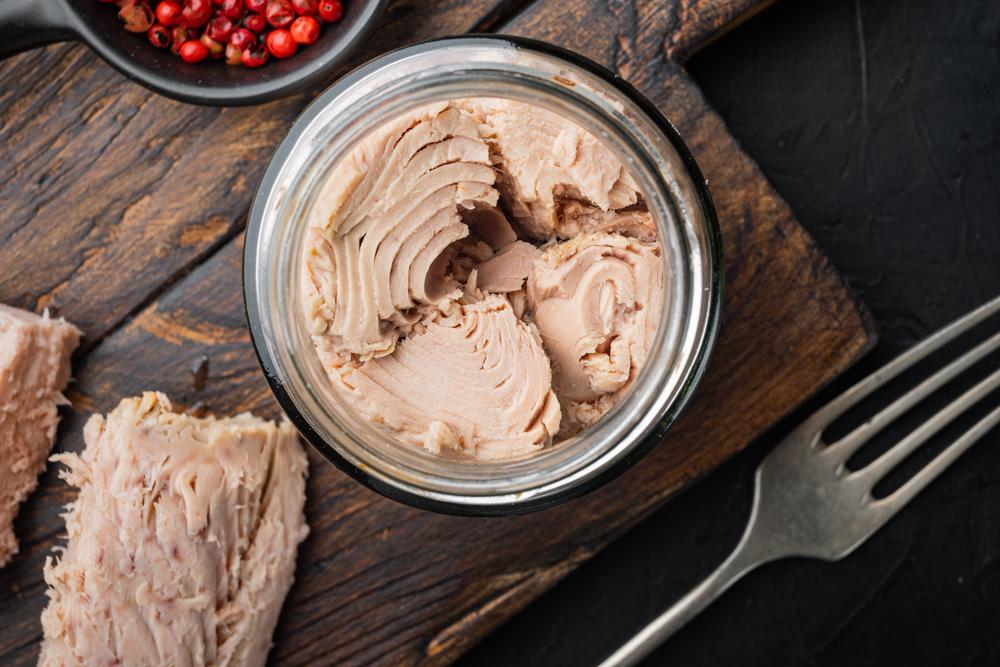 Simply adding cans of tuna, chicken, roast beef, or even deviled ham to your food storage pantry adds that essential layer of protein. (Ilia Nesolenyi/Shutterstock)