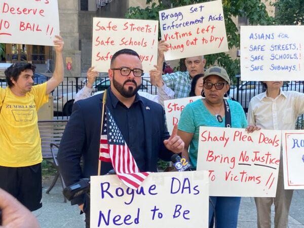 GOP Candidate Desi Cuellar gathers with activists outside of District Attorney Alvin Bragg's office at Collect Pond Park in Manhattan on August 19, 2022. (David Wagner/Epoch Times)