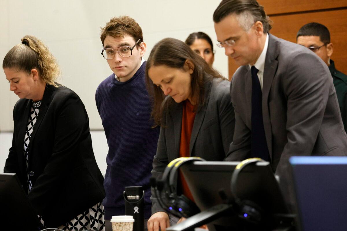 Marjory Stoneman Douglas High School shooter Nikolas Cruz and members of his defense team stand as the jury exits the courtroom during the penalty phase of Cruz's trial at the Broward County Courthouse in Fort Lauderdale, Fla., on Aug. 24, 2022. (Amy Beth Bennett/South Florida Sun Sentinel via AP, Pool)