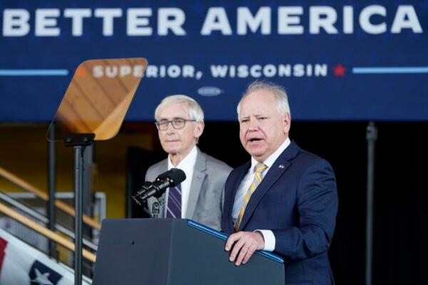Minnesota Gov. Tim Walz speaks as Wisconsin Gov. Tony Evers listens before joining President Joe Biden for an event at the University of Wisconsin-Superior in March 2022. Both Democratic incumbents won reelections on Nov. 8.  (Patrick Semansky/AP Photo)