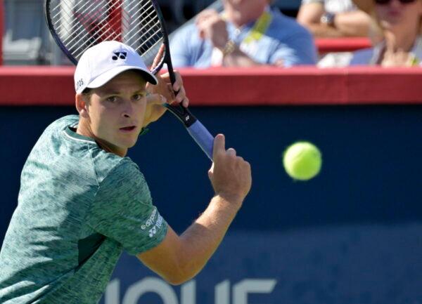 Hubert Hurkacz (POL) hits a backhand against Pablo Carreno Busta (ESP) (not pictured) in the singles finals match during the National Bank Open at IGA Stadium, Montreal, Canada, on Aug 14, 2022. (Eric Bolte/USA TODAY Sports)