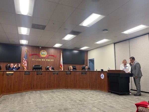 The Orange County Board of Education's new trustee Jorge Valdes (R) is being sworn in by board President Lisa Sparks (2nd R) during a meeting at the Orange County Department of Education in Costa Mesa, Calif., on Aug. 17, 2022. (Micaela Ricaforte/The Epoch Times)