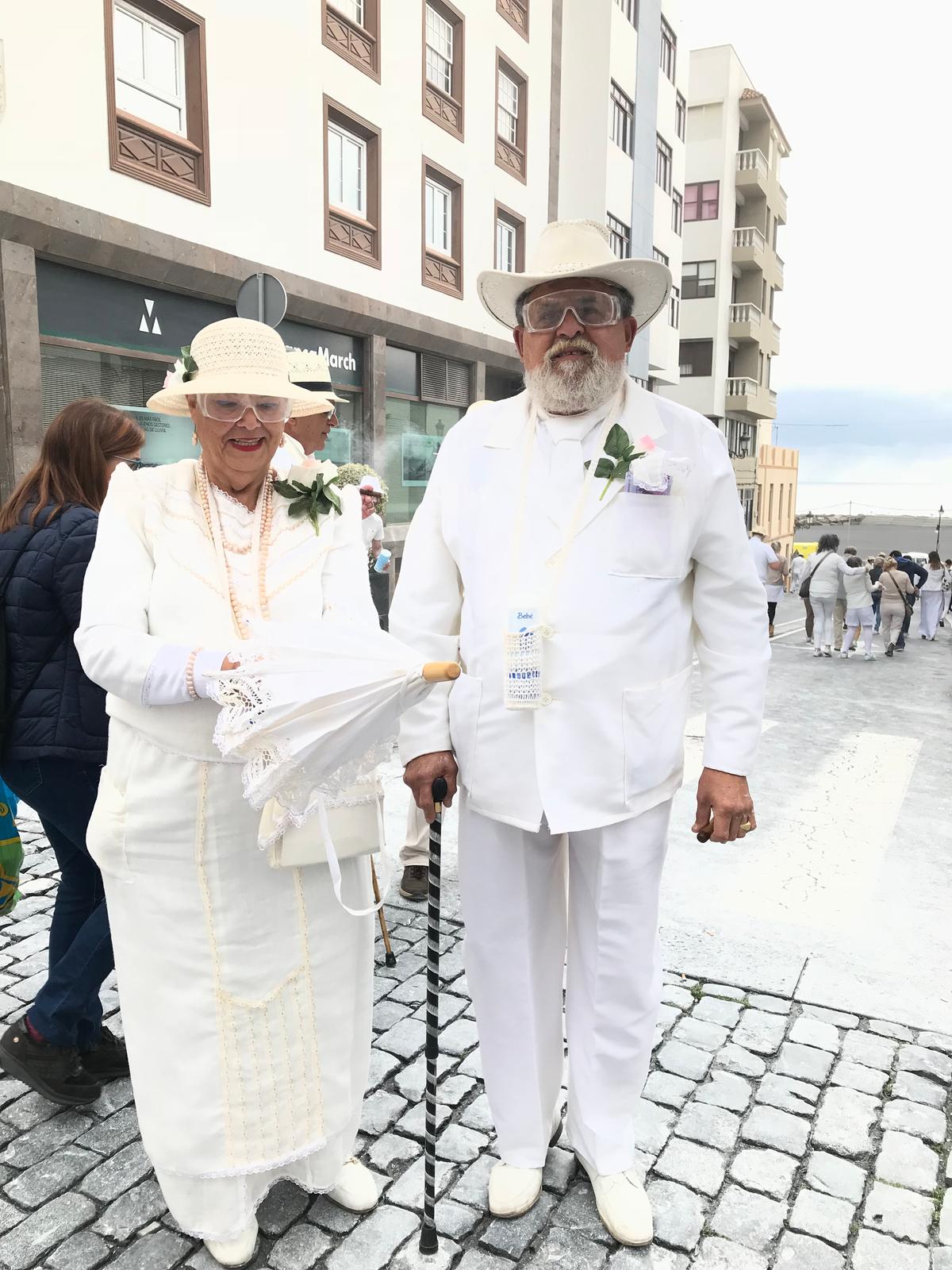A couple dressed in white, as is customary, at the Fiesta de los Indianos. (Xenia Taliotis)