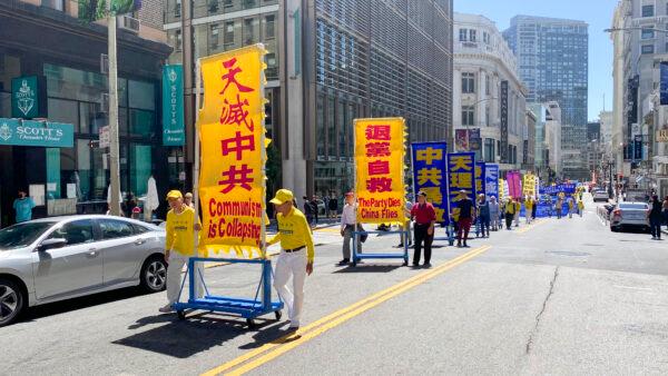 Falun Gong practitioners from around the San Francisco Bay Area hold a parade to celebrate more than 400 million people quitting the Chinese Communist Party, in San Francisco on Aug. 20, 2022. (Ilene Eng/NTD)