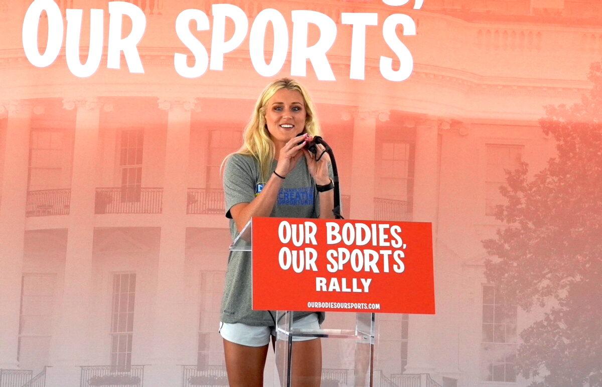 Riley Gaines Barker, a former University of Kentucky swimmer who tied for fifth place against transgender swimmer Lia Thomas at the NCAA Championships in March, speaks at the “Our Bodies, Our Sports” rally at Freedom Plaza in Washington on June 23, 2022. (Terri Wu/The Epoch Times)