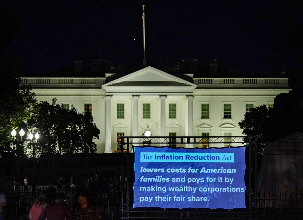 A projection display of the DNC passage of the Inflation Reduction Act is displayed in front of the White House in Washington on Aug. 12, 2022. (Jemal Countess/Getty Images for DNC)