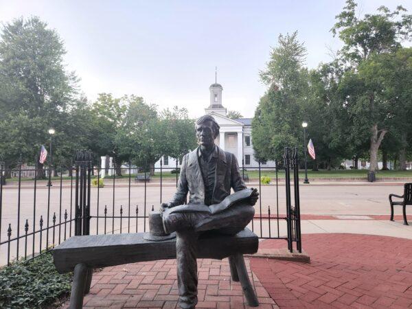 A sculpture of a young Abraham Lincoln sits in Lincoln Park across the street from the old state capitol building in Vandalia, Ill., in a file photo. (Jeff Louderback/The Epoch Times)