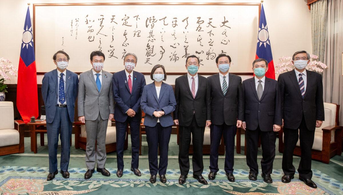 Taiwan President Tsai Ing-wen pose for a photo with the member of the House of Representatives of Japan Keiji Furuya and other members of the delegation at the presidential office in Taipei, Taiwan, on Aug. 23, 2022. (Taiwan Presidential Office/Handout via Reuters)
