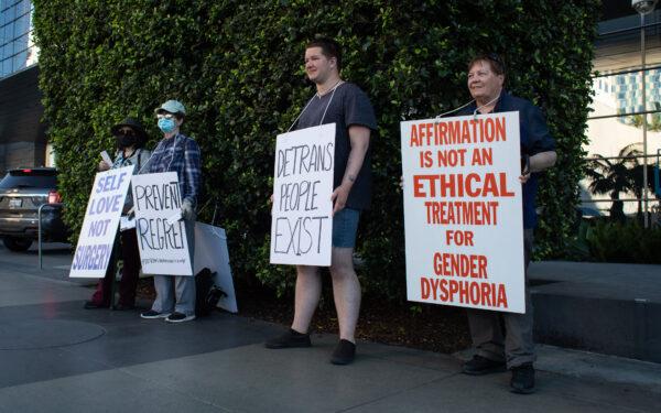 Demonstrators reach out to Los Angelenos about complications associated with gender reassignment surgeries in downtown Los Angeles on March 12, 2022. (John Fredricks/The Epoch Times)