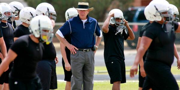 Odessa Permian head coach Gary Gaines (C) watches his high school football players work out in Odessa, Texas, on May 21, 2009. (Kevin Buehler/AP Photo)