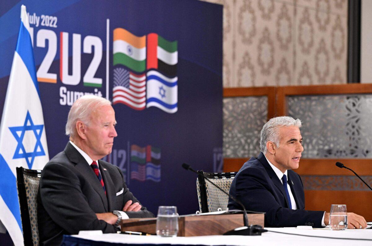 <br/>US President Joe Biden (L) and Israel's Prime Minister Yair Lapid, take part in a virtual meeting with leaders of the I2U2 group, which includes, the US, Israel, India, and the United Arab Emirates, at a hotel in Jerusalem, on July 14, 2022. (Mandel Ngan/AFP via Getty Images)