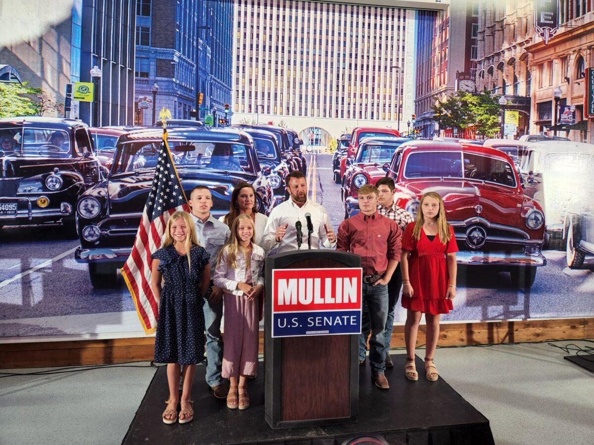 Rep. Markwayne Mullin is joined by his family during his victory speech in Tulsa, Okla., on Aug. 23 after winning the GOP primary runoff for U.S. Senate. (Jeff Louderback/The Epoch Times)