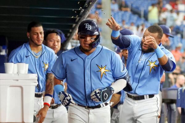 Tampa Bay Rays' Isaac Paredes, center, is congratulated after his home run against the Los Angeles Angels during the sixth inning of a baseball game in St. Petersburg, Fla., Aug. 23, 2022. (Mike Carlson/AP Photo)