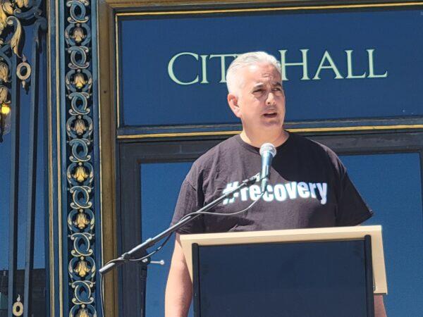 Addiction recovery advocate Tom Wolf speaks in front of City Hall in San Francisco on Aug. 21, 2022, for National Fentanyl Prevention and Awareness Day. (Jason Blair/Epoch Times)