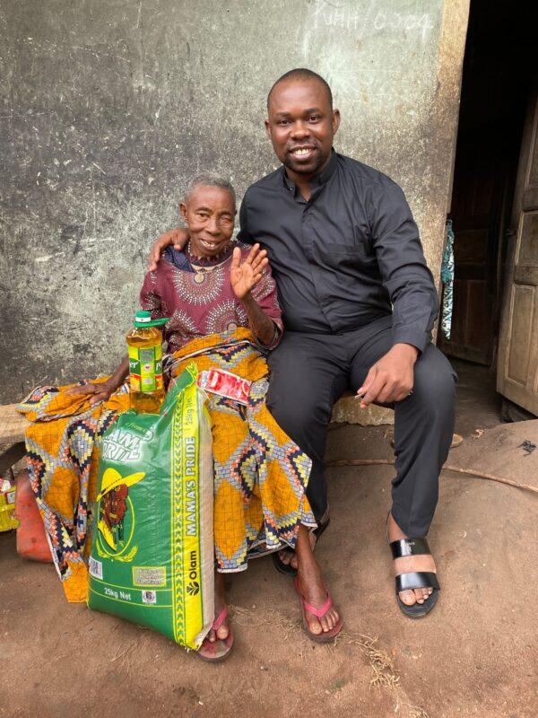Fr. Theodore Ihenetu (R) and Veronica, a senior, in Nigeria. (Courtesy of Hands 4Life)