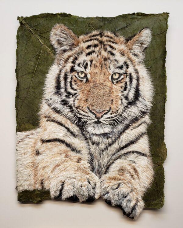 Korean-born artist Yun Gee Bradley is in awe of wild animals, from their colors to the details of their eyes and coats. “It reminds me that there is a touch of God in everything,” she said in her artist’s statement. Bradley’s artwork (of a tiger) is titled “Patience,” which is also the virtue she applies to making each of her pieces. For centuries, Korean artists have used “hanji” (Korean mulberry paper) for weaving, felting, and cording, but Bradley uses the paper for a new technique. She uses tweezers to pull fibers from the hanji, which she then glues fiber by fiber onto her work to create detailed tactile compositions that appear as sculptural reliefs. Short-listed finalist in the Earth's Wild Beauty category: “Patience” by Yun Gee Bradley (U.S.). Mulberry bark and paper; 11 3/4 inches by 16 1/8 inches. (Courtesy of DSWF)
