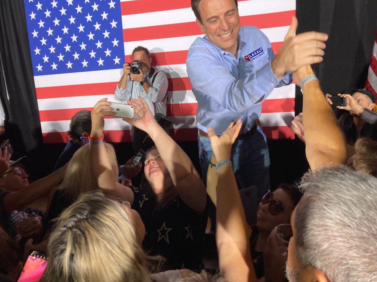 Republican U.S. Senate candidate Adam Laxalt greets supporters at a June 10, 2022, rally in Las Vegas before winning his Republican primary to take on incumbent Sen. Catherine Cortez Masto (D-Nev.) in November. (John Haughey/The Epoch Times)