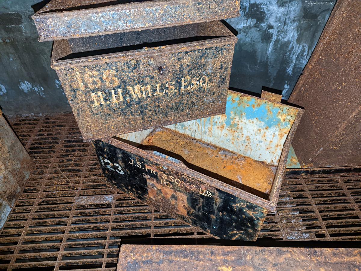 The explorers find rusted chests inside the abandoned WWII archives. (Courtesy of Caters News)