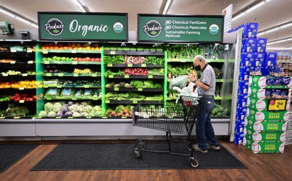 A shopper looks at organic produce at a supermarket in Montebello, Calif., on Aug. 23, 2022. (Frederic J. Brown/AFP via Getty Images)