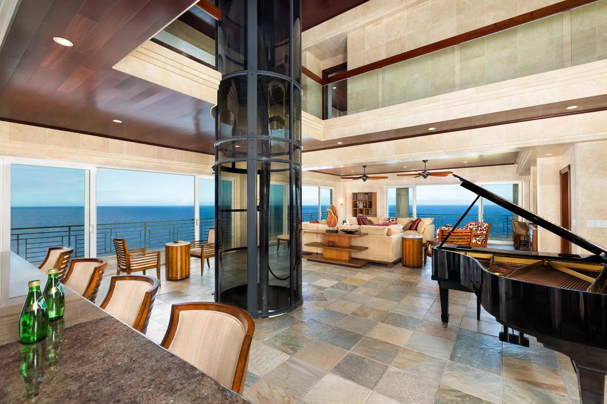 The glass elevator whisks you to the bedrooms and up to the rooftop gathering area. (Sotheby's Concierge Auctions)