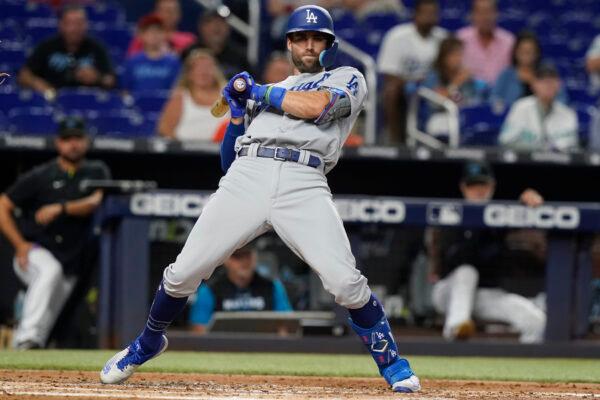 Los Angeles Dodgers' Chris Taylor (3) bends backwards to avoid a pitch during the second inning of a baseball game against the Miami Marlins in Miami, Aug. 26, 2022. (Marta Lavandier/AP Photo)