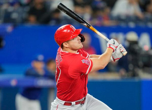 Mike Trout #27 of the Los Angeles Angels hits a home run against the Toronto Blue Jays in the eighth inning during their MLB game at the Rogers Centre in Toronto, Ontario, Canada, on August 26, 2022. (Mark Blinch/Getty Images)