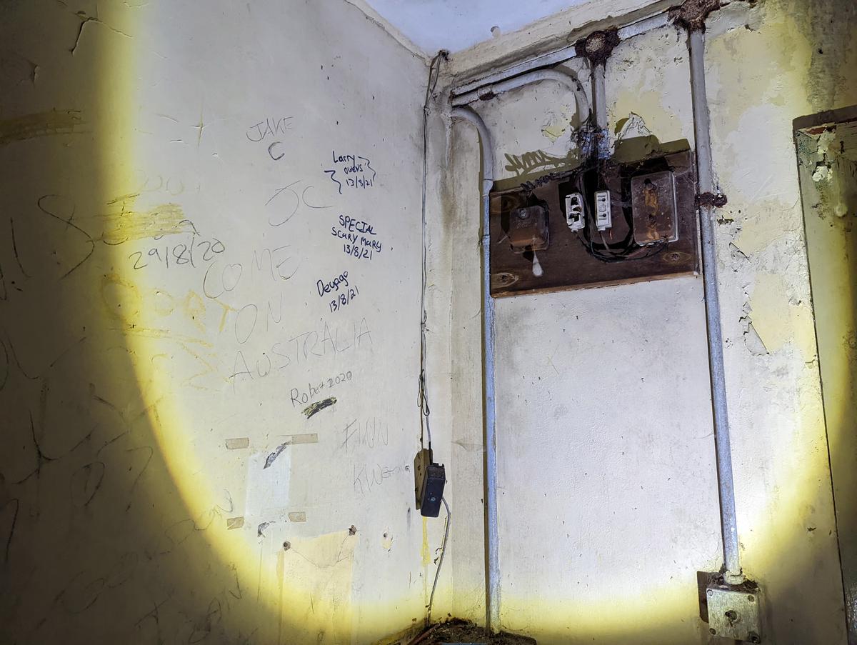 Graffiti marks the interior of the abandoned facility. (Courtesy of Caters News)