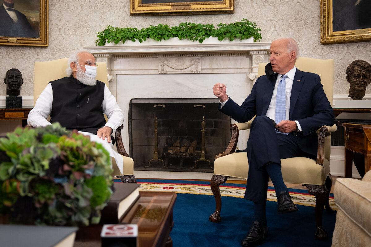 U.S. President Joe Biden (R) gestures as he speaks with Indian Prime Minister Narendra Modi during a bilateral meeting in the Oval Office of the White House on Sept. 24, 2021 in Washington, DC. President Biden  hosted a Quad Leaders Summit later that day with Prime Minister Modi, Australian Prime Minister Scott Morrison, and Japanese Prime Minister Suga Yoshihide. (Sarahbeth Maney-Pool/Getty Images)