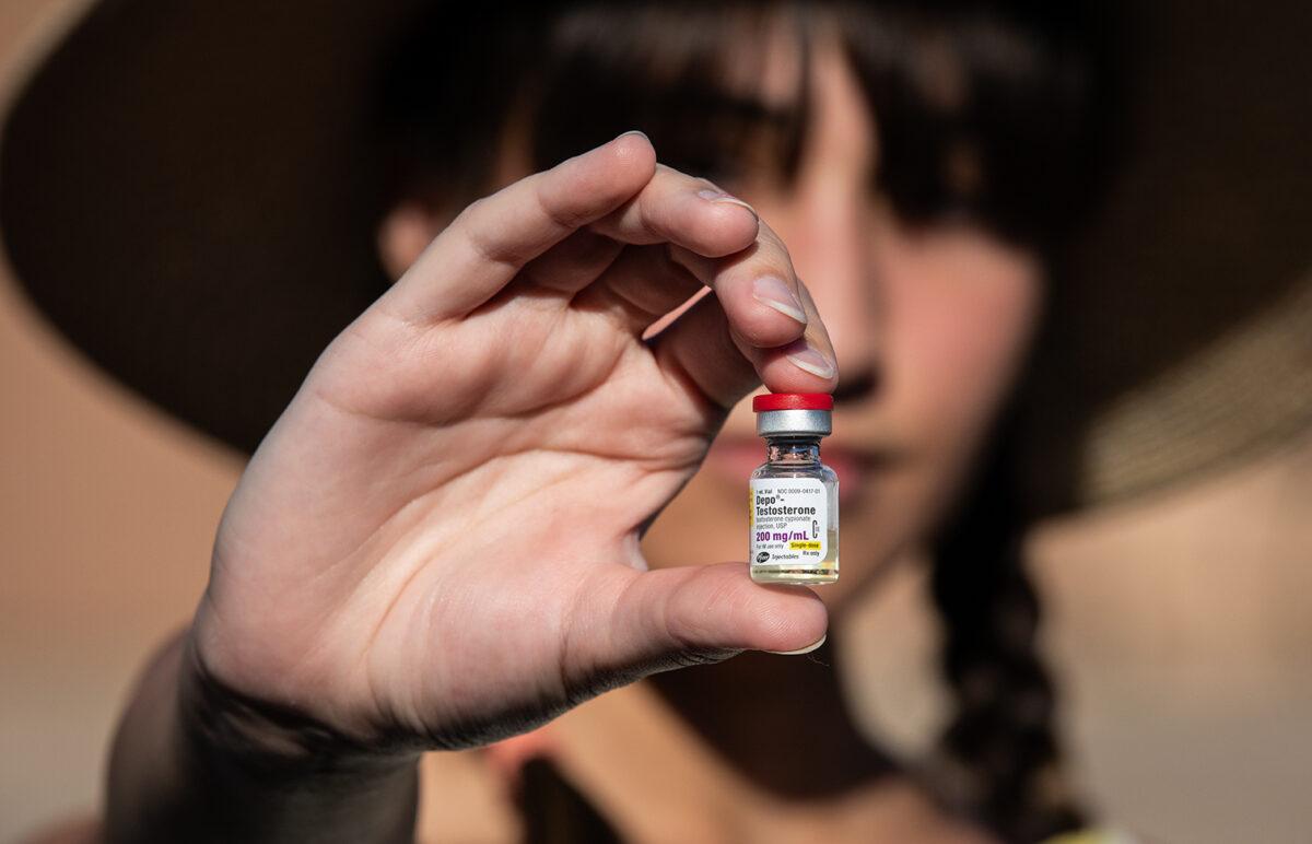 Chloe Cole holds testosterone medication used for transgender patients, in Northern California on Aug. 26, 2022. (John Fredricks/The Epoch Times)