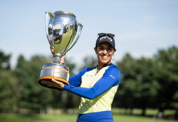 Paula Reto, of South Africa, holds the trophy after winning the the Canadian Pacific Women's Open golf tournament in Ottawa, Aug. 28, 2022. (Justin Tang/The Canadian Press via AP)