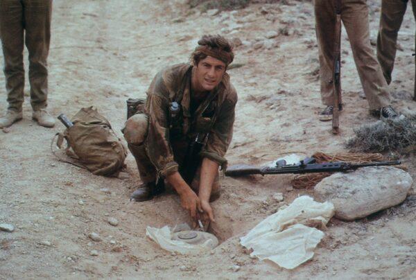 Ranulph Fiennes as a demolition expert in the British Special Forces defusing a land mine. His exploits are featured in "Explorer." (Findany Film)
