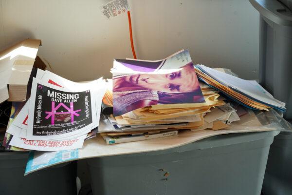 Documents on missing persons pile up at Domingo Ramos’ garage office in Middletown, N.Y., on Aug. 25, 2022. (Cara Ding/The Epoch Times)