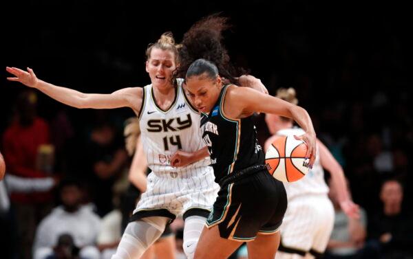 New York Liberty forward Betnijah Laney (44) drives to the basket against Chicago Sky guard Allie Quigley (14) during the first half of a WNBA basketball playoff game in New York on Aug. 23, 2022. (Noah K. Murray/AP Photo)