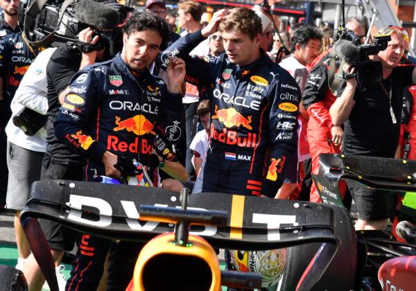 First place, Red Bull driver Max Verstappen of the Netherlands (R), speaks with second place Red Bull driver Sergio Perez of Mexico sin the Parc Ferme after the Formula One Grand Prix at the Spa-Francorchamps racetrack in Spa, Belgium, on Aug. 28, 2022. (Geert Vanden Wijngaert/AP Photo, Pool)